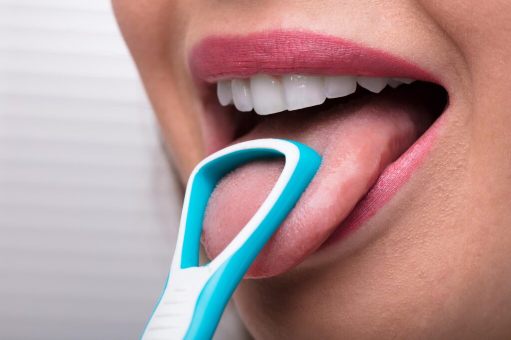 Eva Mondzorg Woman Cleaning Her Tongue With Cleaner